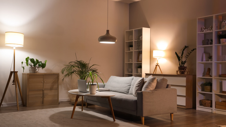 Living room with multiple lamps and light sources