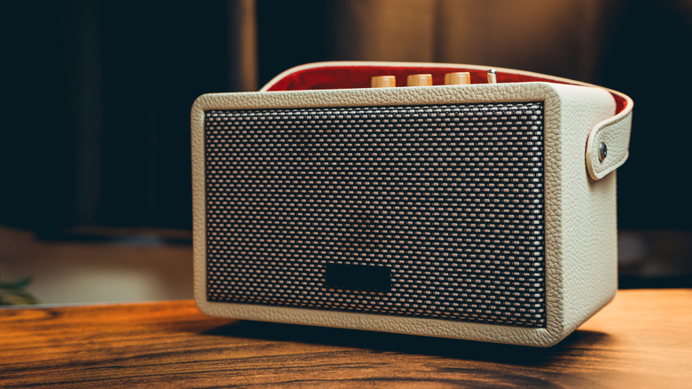Vintage-style speaker sitting on a wood table