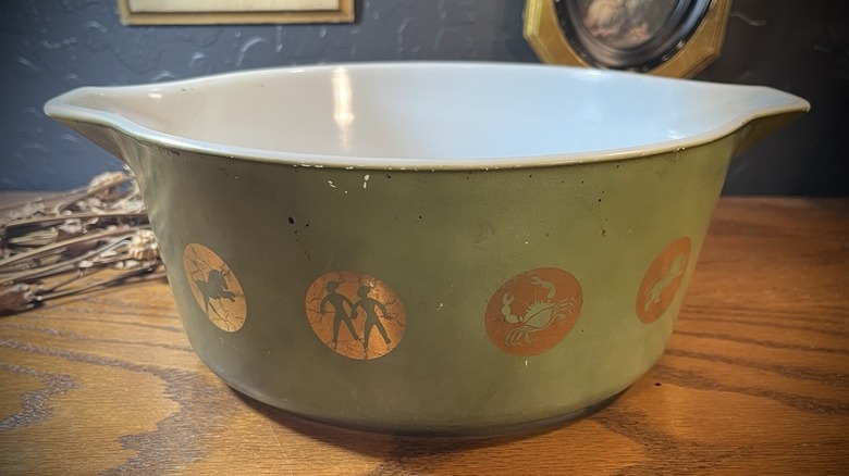 A green zodiac sign Pyrex dish.