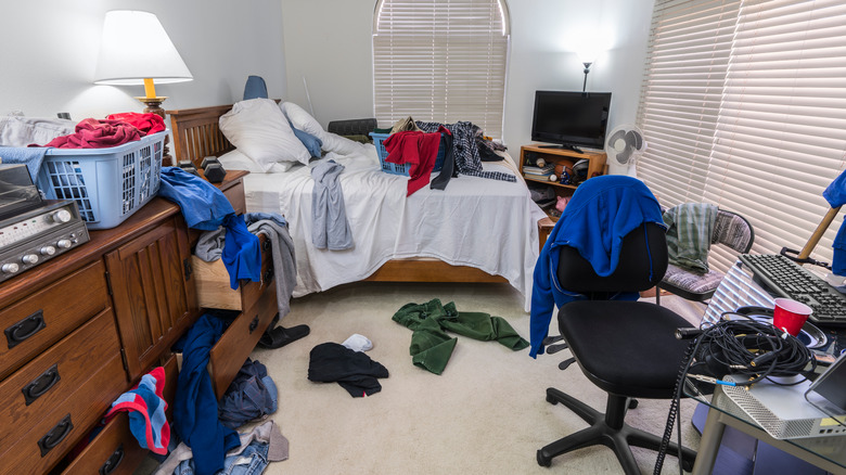 Messy bedroom with clothes on floor