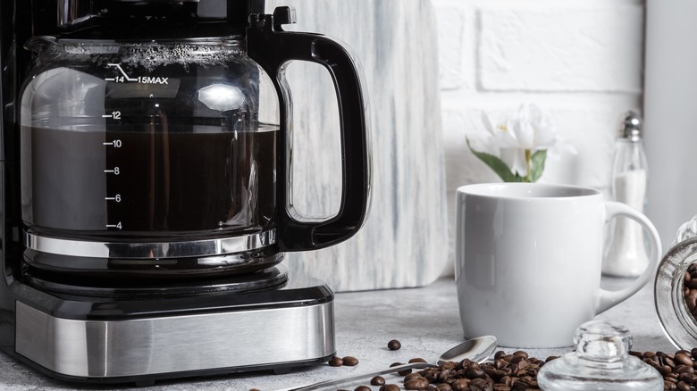 black coffee machine with mug
