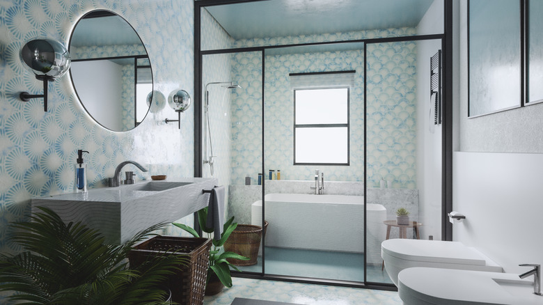 A modern bathroom with blue patterned walls