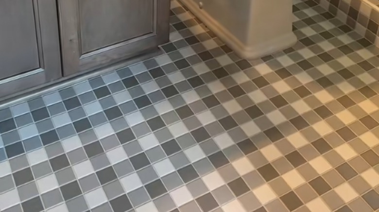 Gray and white gingham custom tiled floor in a bathroom