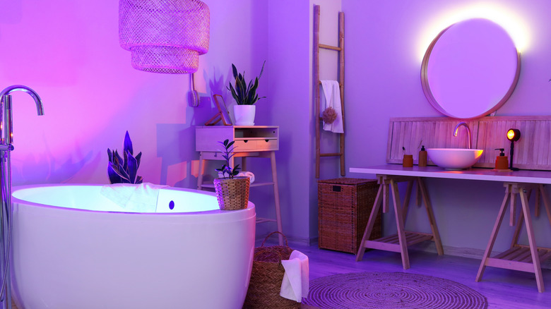 Bathroom with purple glow from various LED light sources