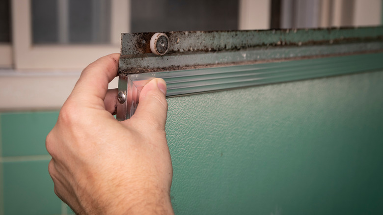 cleaning shower door tracks