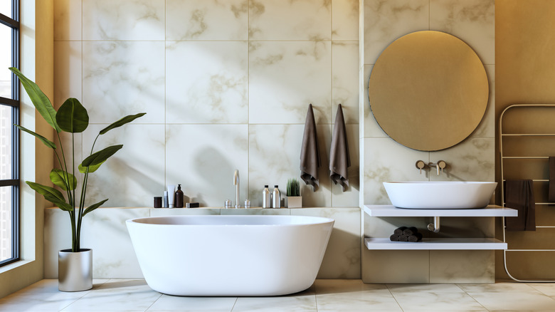 Stylish timeless bathroom with white marble tiles