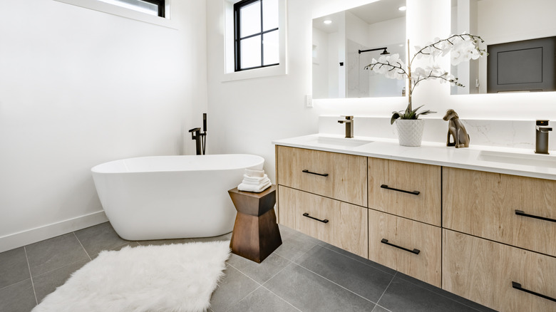 A bathroom with a large floating vanity unit