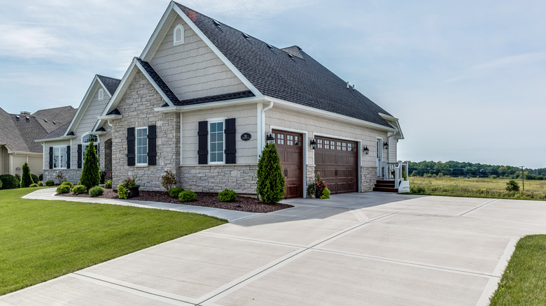 Detached home with a concrete driveway