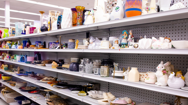 Shelf full of home decor and vintage items at a thrift store