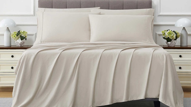beige costco sheets on bed