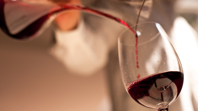 Pouring red wine into glass