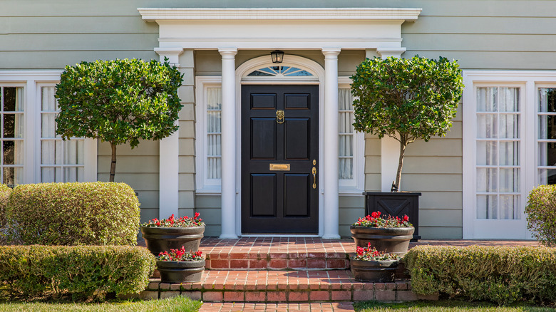 porch with black front door