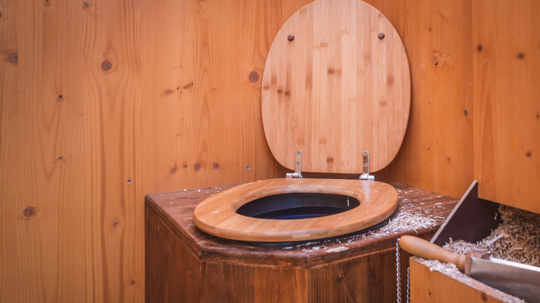 A wooden compost toilet