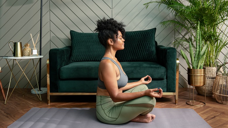 woman meditating in wellness room