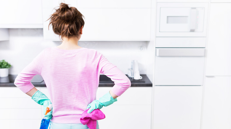 Person about to clean kitchen