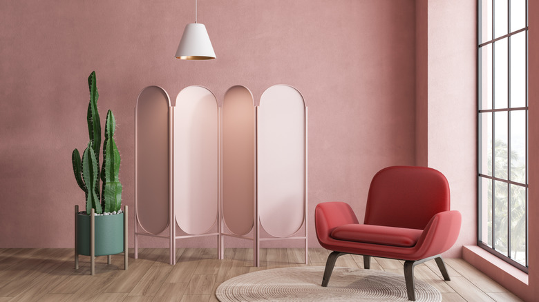 deep millennial pink accent wall with decor