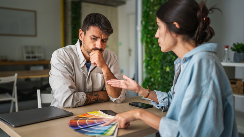 Couple choosing a paint color together
