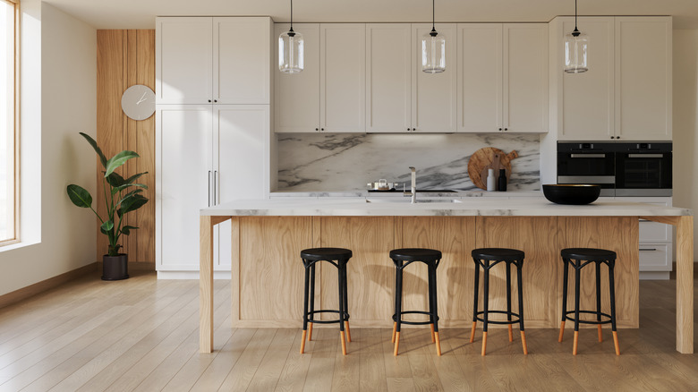 Bright, airy modern kitchen with bar stools