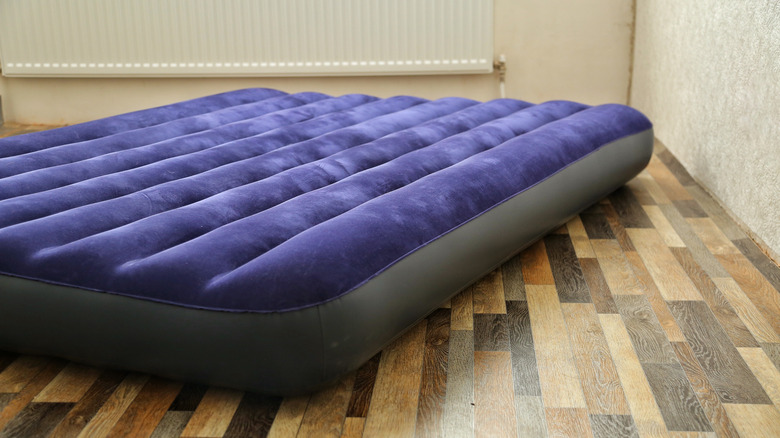 air mattress on wood floor