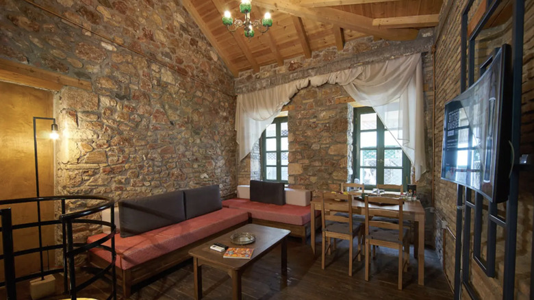 Living room with stone walls