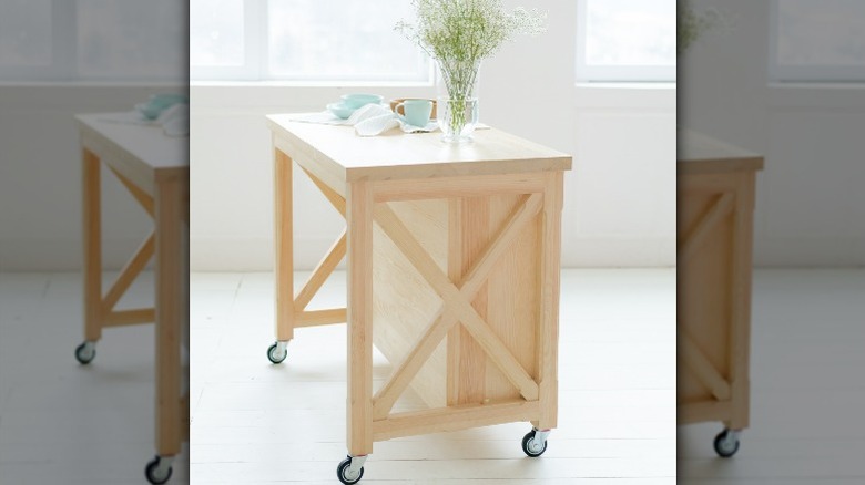 Small wooden rolling kitchen island
