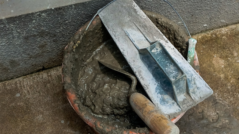 grout and grouting tools in bucket