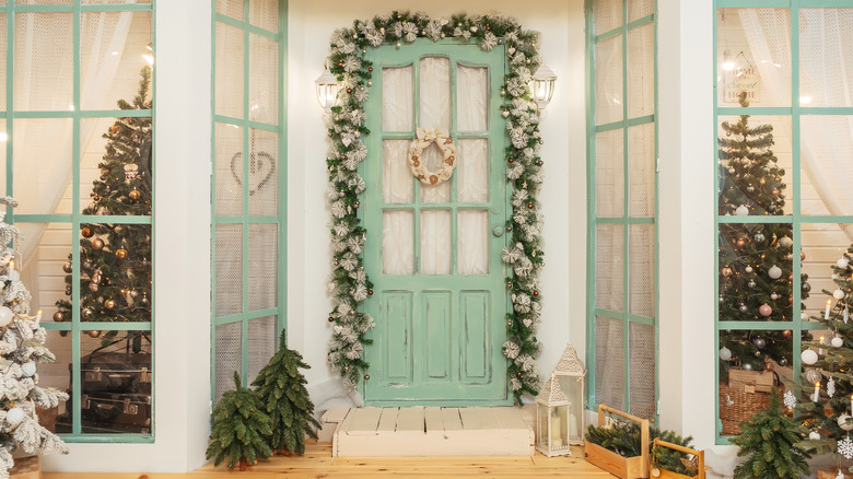 garland over green front door