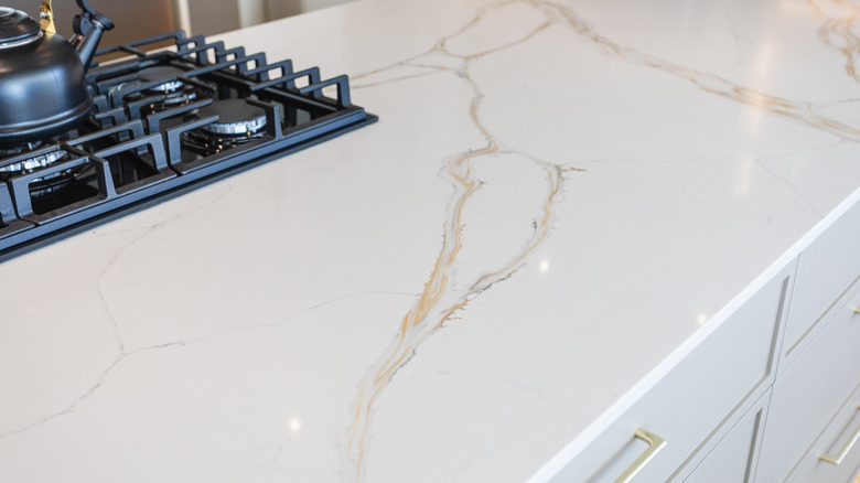 Kitchen island with Calacatta gold engineered quartz countertop