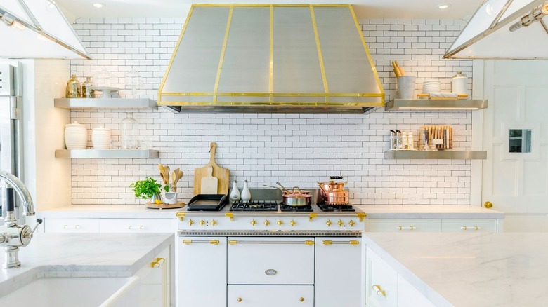 Marble countertop white tile backsplash kitchen