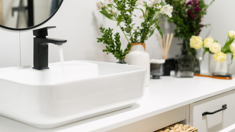 Porcelain bathroom countertop with black faucet