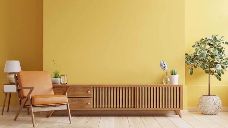 yellow room with wood furniture