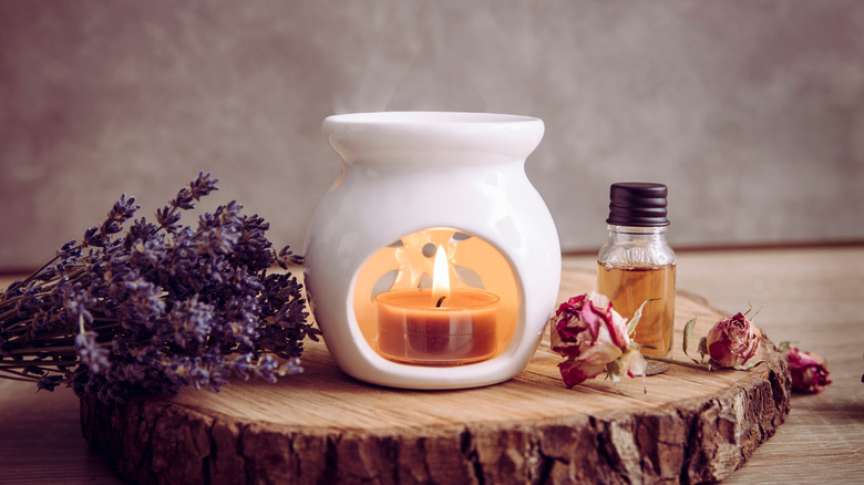 Candle with lavender beside it