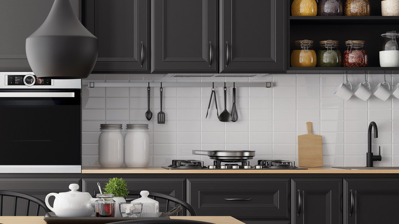 black cabinet with wood counters