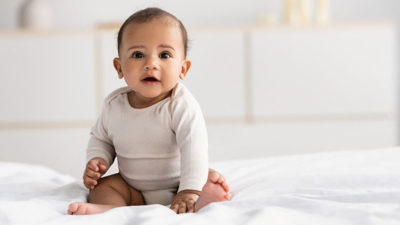 a baby on a bed