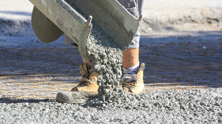 Workers pouring a concrete driveway