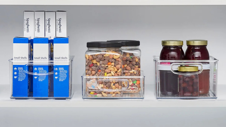 Large clear bins holding packs of food