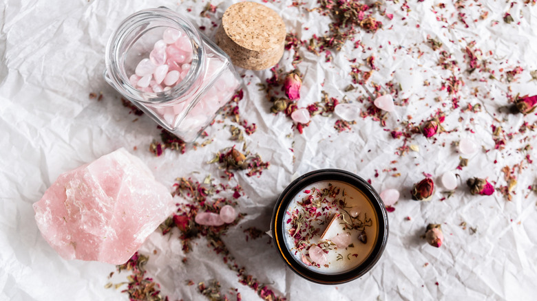 rose quartz crystal with candle 