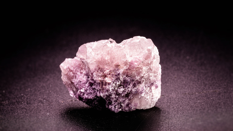 lepidolite crystal against dark background