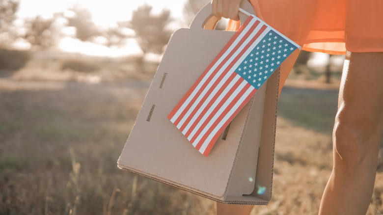 Woman holding American flag