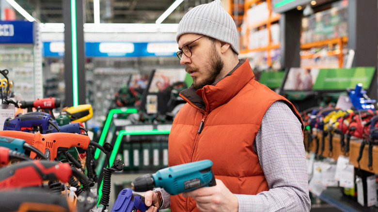 Man shopping for power tools