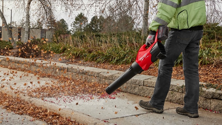 Man using Milwaukee leaf blower