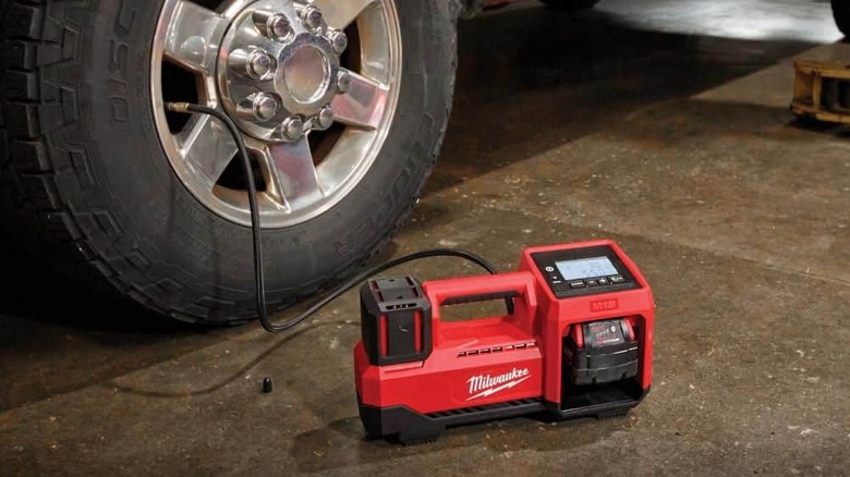 Milwaukee tire inflator on ground