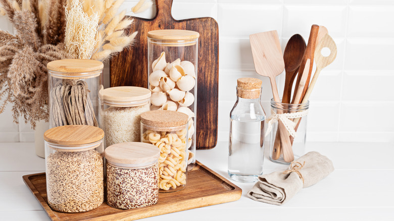 recycled food jars turned storage jars with glass knob tops