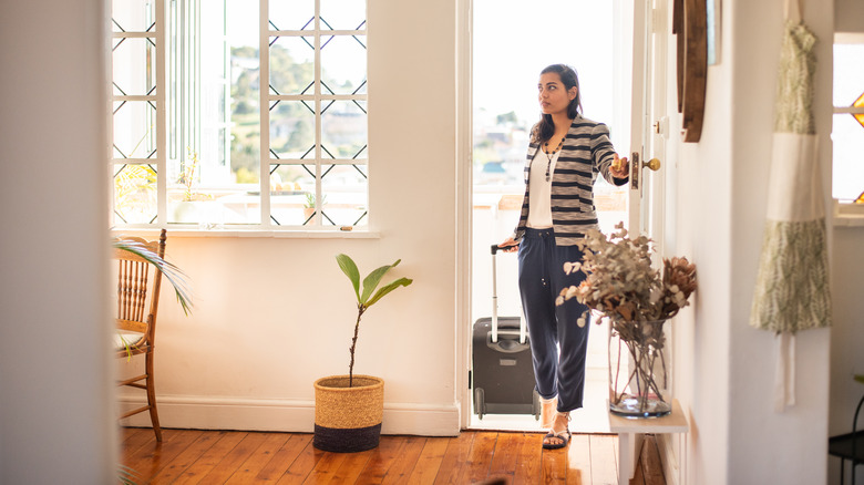 Woman walking through home entryway