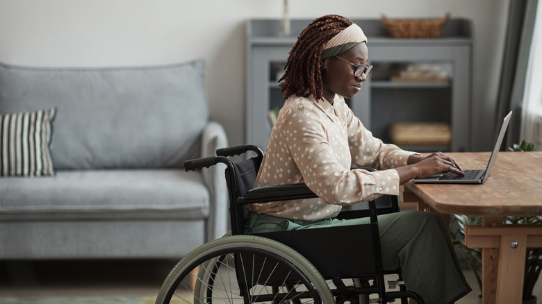woman in wheelchair at home
