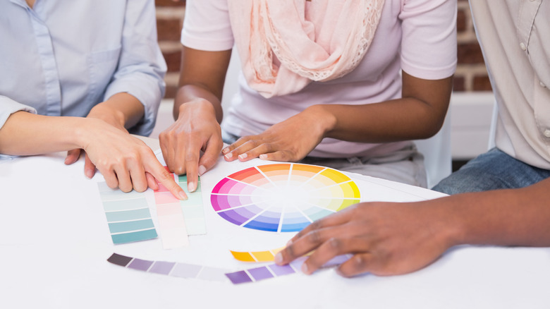 People looking at color wheel