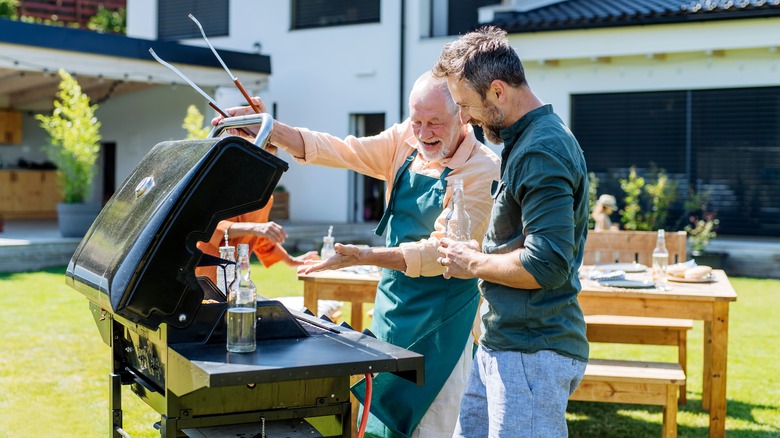 father and son grilling