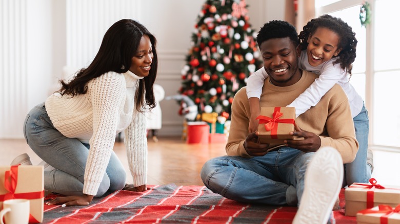 Family opening Christmas presents