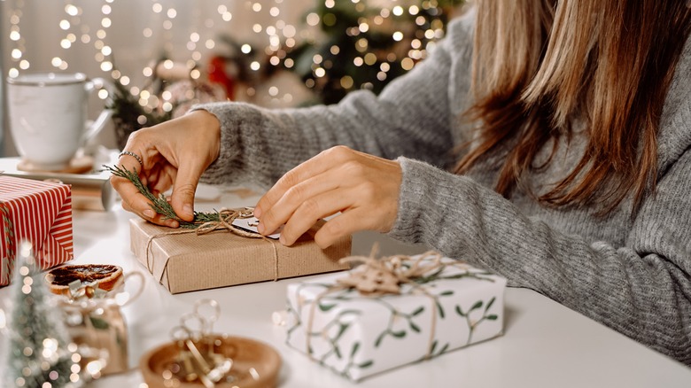 woman wrapping Christmas presents