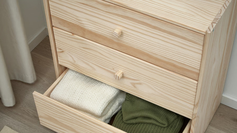 IKEA RAST drawers up close with bottom drawer opened and clothing inside